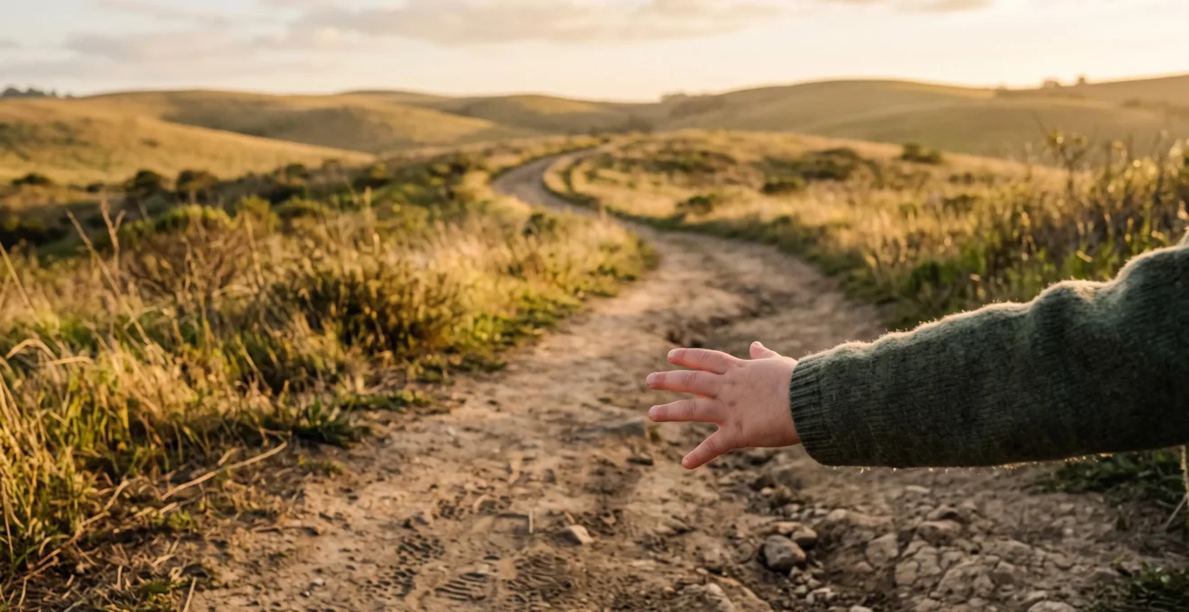 A child's hand reaching upward along a natural pathway, symbolizing gradual progress and effort over a fixed destination